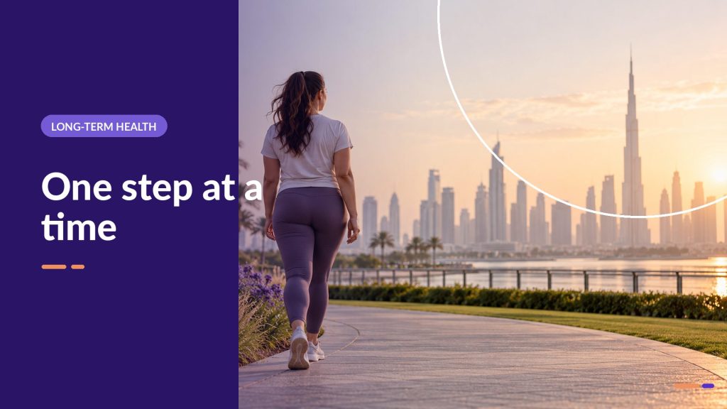 One step at a time: woman walking along a waterfront path with the Dubai skyline behind her